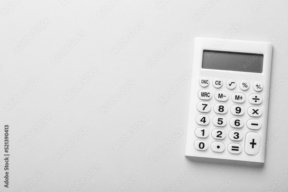 White calculator on light background, top view. Space for text White calculator on light background, top view. Space for text