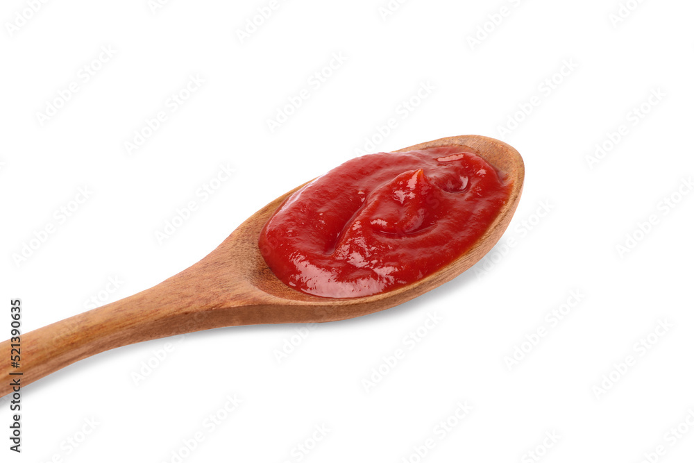 Ketchup in wooden spoon isolated on white, closeup Ketchup in wooden spoon isolated on white, closeup