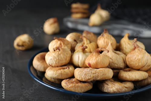 Tasty dried figs on grey table, closeup