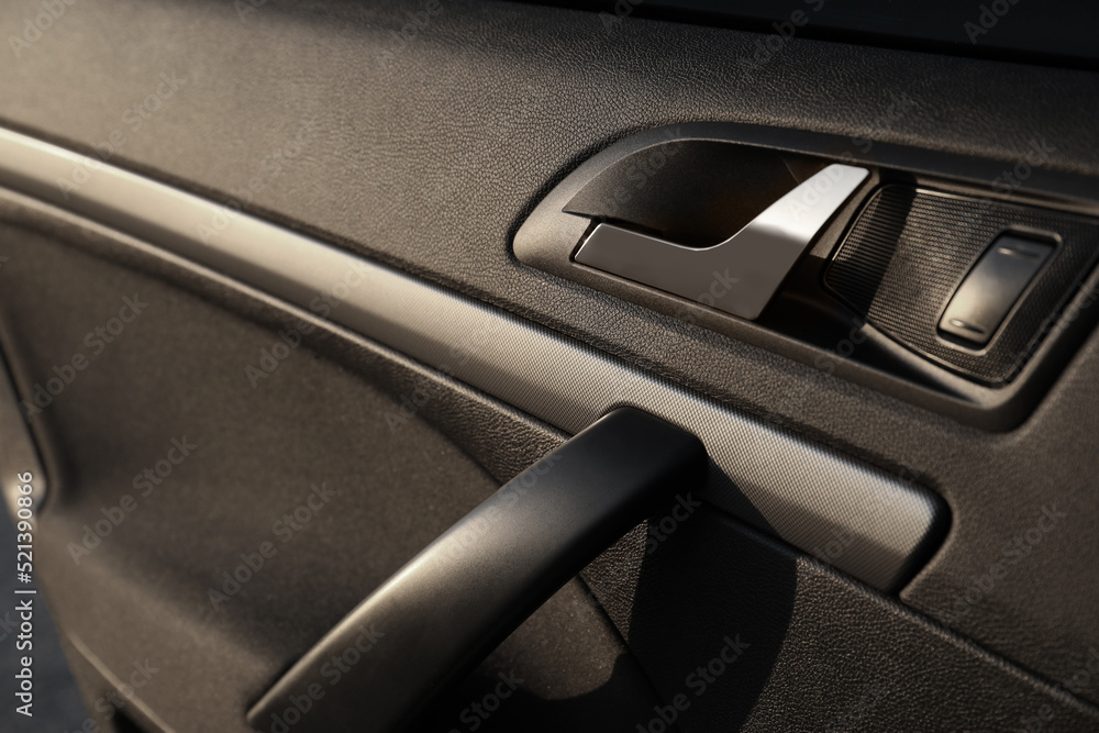 Closeup view of car door with handle