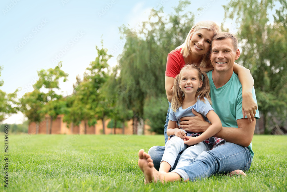 Happy family spending time together in park on sunny summer day Happy family spending time together in park on sunny summer day