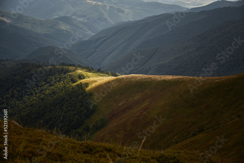 Spot of sunlight on mountain range. Carpathian Mountain, Ukraine. Walking and hiking trails in Borzhava ridge. Rural area of carpathian mountains in autumn