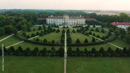 Fertod, Hungary - 4K Aerial view of Eszterhazy Palace near Sopron. Flying over Eszterhazy castle and garden on a bright summer morning at sunrise