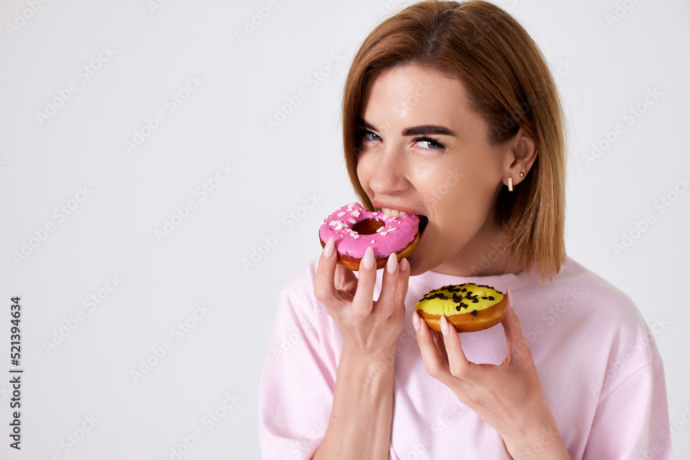 beautiful blonde woman with donuts on white background. beautiful blonde woman with donuts on white background.