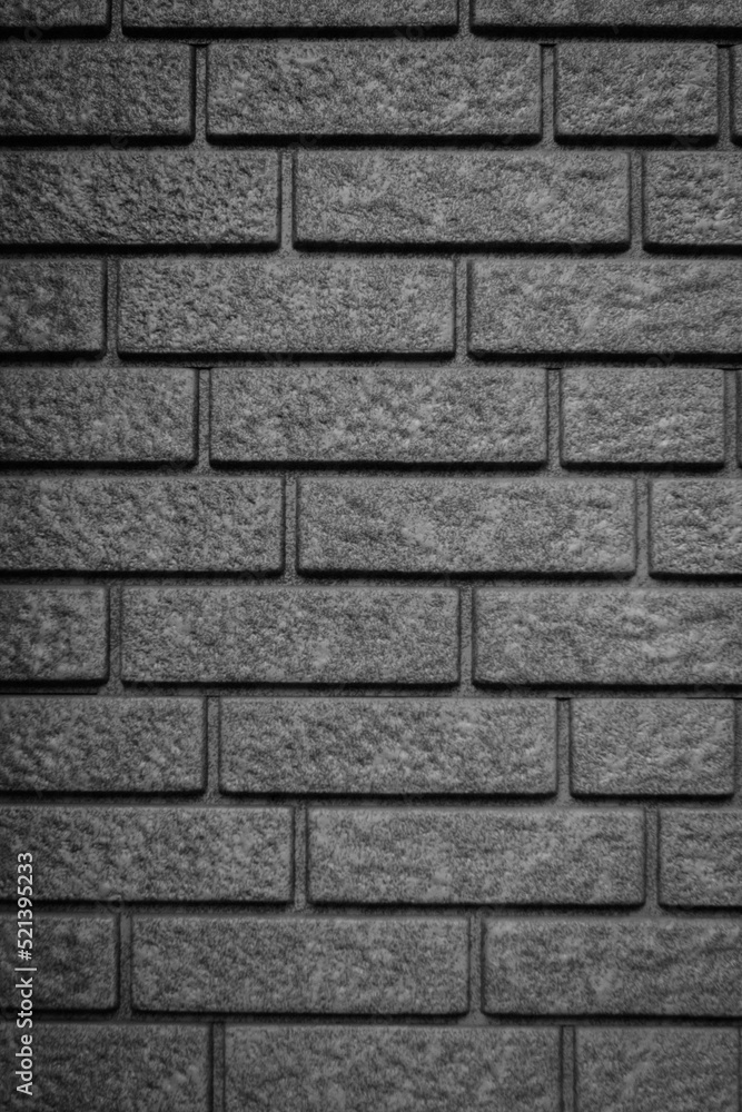 Texture of gray embossed decorative bricks