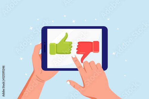 Customer feedback, rating and review concept. Human hands holding tablet with like and dislike. Thumb up and down on computer pc screen. Blogging, online messaging, social network services