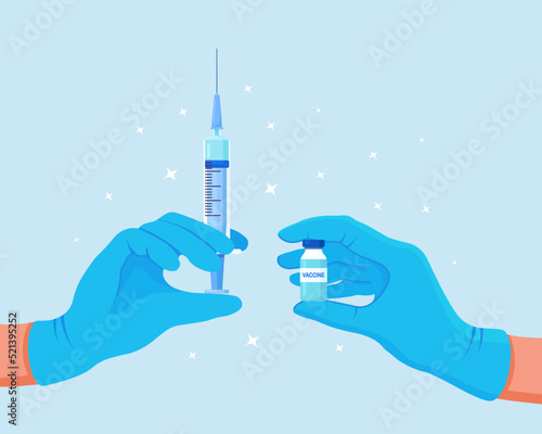 COVID-19 coronavirus vaccine. Doctor's hand in blue medical gloves hold medicine vaccine vial bottle and syringe. Vaccination concept