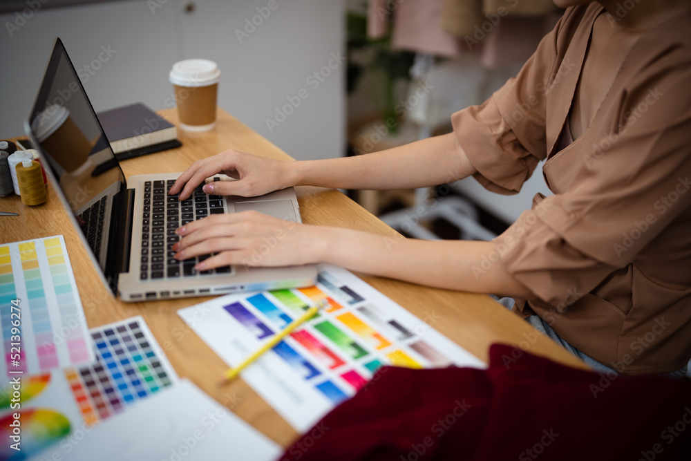 Fototapeta premium Start-up Stylish Fashion Designer work as sketch of new collection in atelier. Creative Design Concept.
