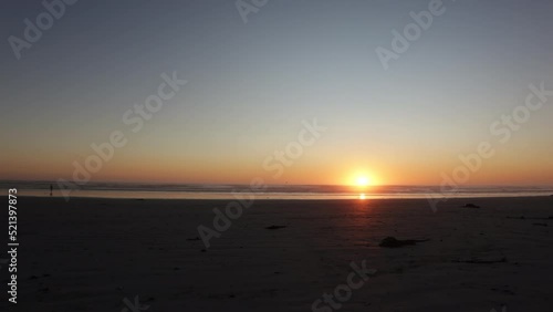 Time lapse footage of the sunset at Melkbosstrand Beach in Cape Town photo