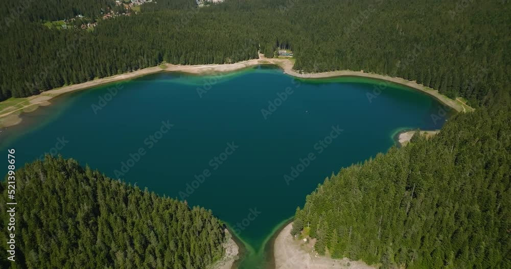 aerial view of black lake in shape of stingray aerial view of black lake in shape of stingray