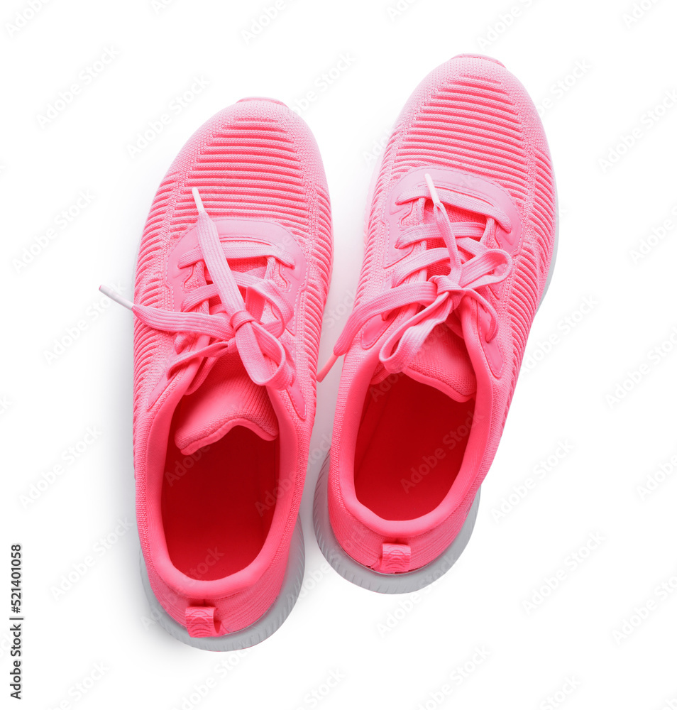 Pair of stylish pink sneakers on white background, top view Pair of stylish pink sneakers on white background, top view