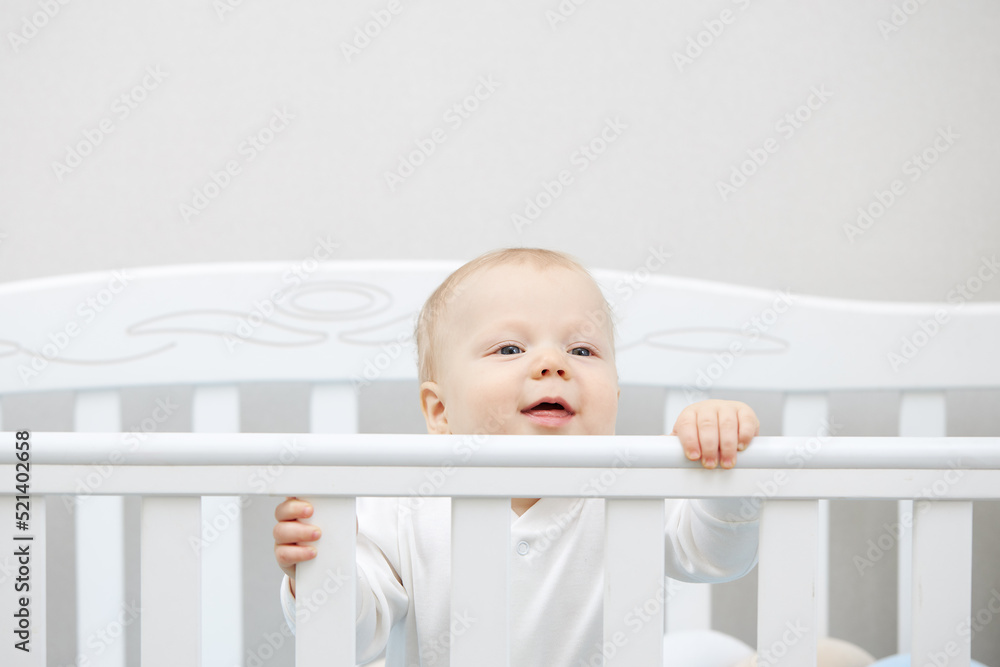 Portrait of a peaceful cute kid lying on the bed while sleeping. The