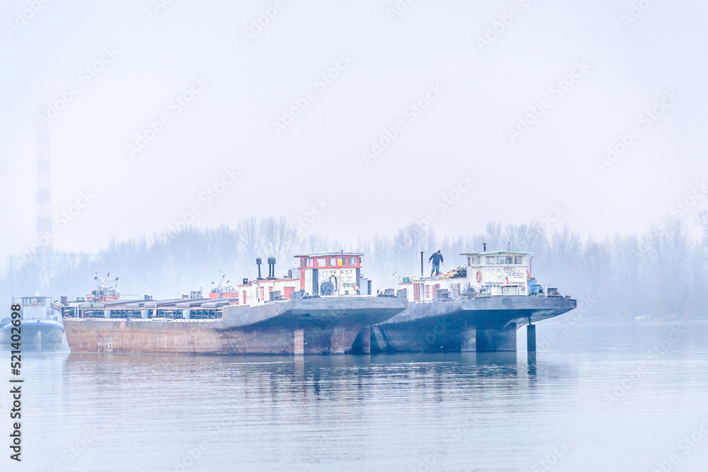 Anchored tankers during the winter period on the Danube River.