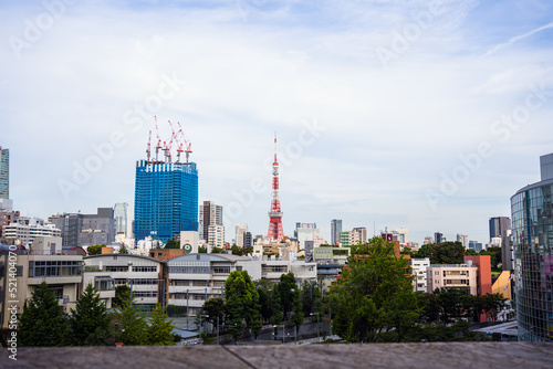 Tokyo tower with some small buildings on a cloudy day at Roppongi Japan