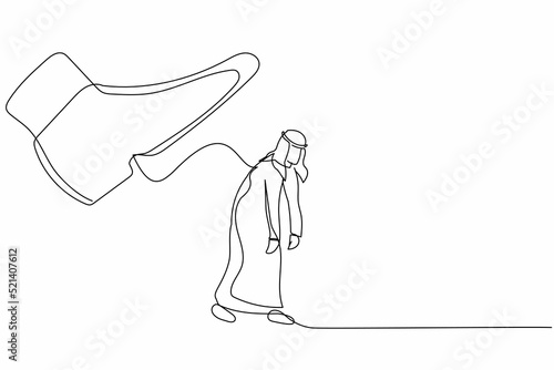 Single one line drawing sad Arabian businessman going away with huge boot shoe kicking him out. Male manager being fired and kicked out concept. Continuous line draw design graphic vector illustration