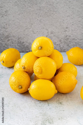 Fresh lemon. Yellow lemon on stone background. close up