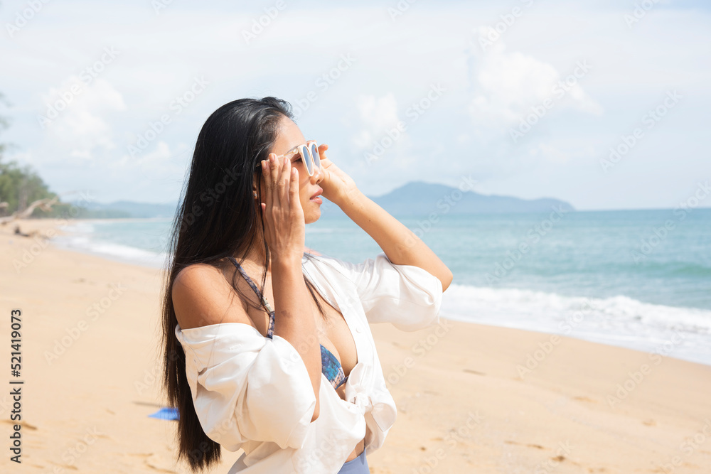 beautiful woman have sunglasses happy vacation in summer on the beach
beautiful woman have sunglasses happy vacation in summer on the beach