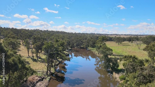 Drone shot of Severn River and its surrounding countryside in Glen Innes, NSW, Australia photo