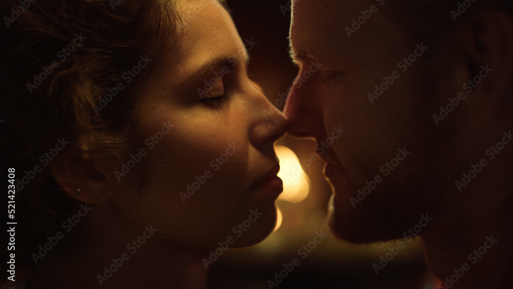 Sexy couple touch noses together. Tender lovers faces express feelings on date. Sexy couple touch noses together. Tender lovers faces express feelings on date.