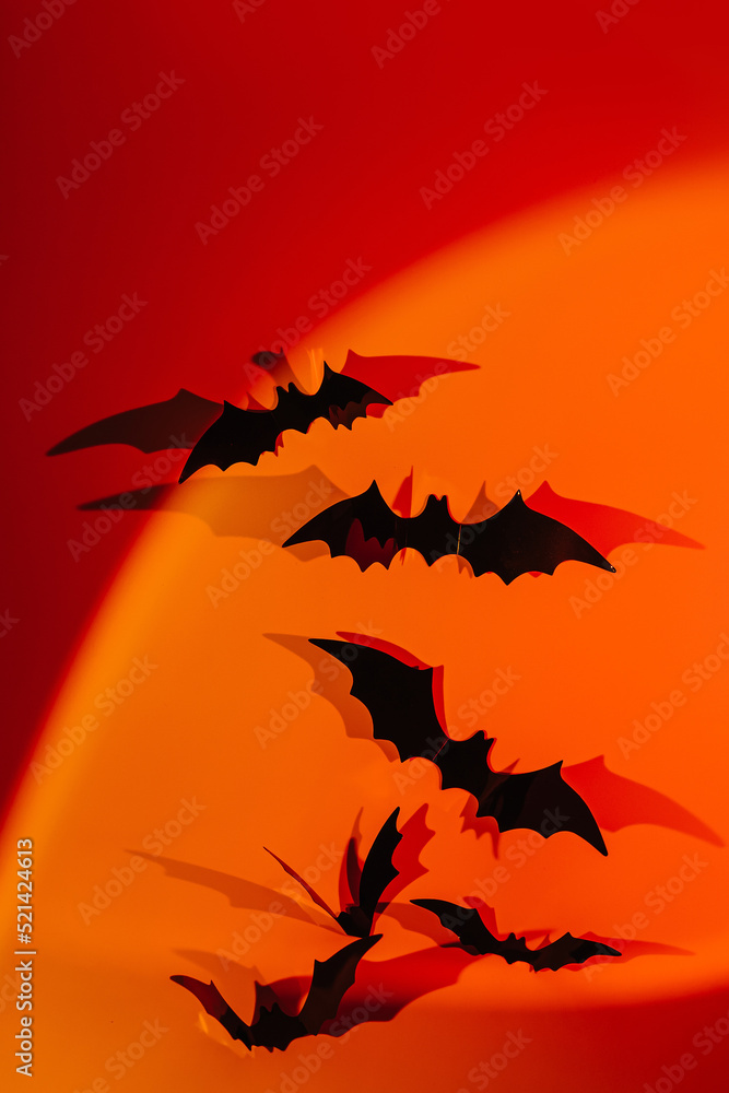 Halloween black bats on neon gradient background with space. Happy Halloween Halloween black bats on neon gradient background with space. Happy Halloween
