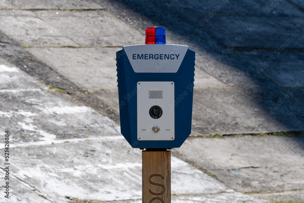 SOS, police, emergency button in the public park. SOS, police, emergency button in the public park.