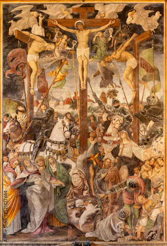 VARALLO, ITALY - JULY 17, 2022: The renaissance fresco of Cricifixion in the church Chiesa Santa Maria delle Grazie  by Gaudenzio Ferrari (1513). photo
