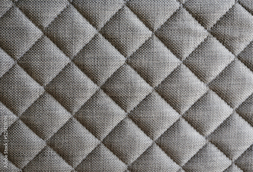 Close up shot of white orthopedic mattress top side surface pattern with a lot of copy space for text. Hypoallergenic foam matress for proper spinal alignment and pressure point relief. Background © Evrymmnt
