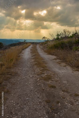 Texas Hill Country storm approaching a dirt road