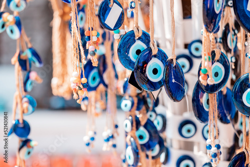 Print op canvas Evil eye turkish bead amulets hanging in souvenir store