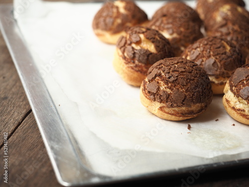 Choux au craquelin on baking tray photo