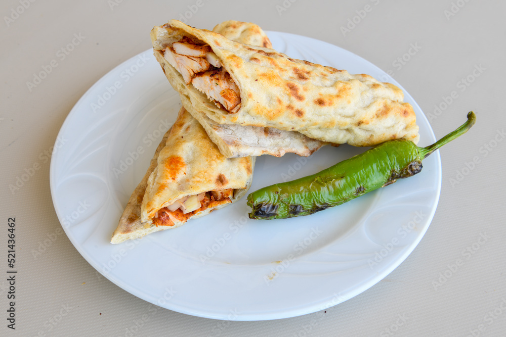 Lavash doner kebab ( doner zurna durum ) or shawarma sliced in plate isolated. Lavash doner kebab ( doner zurna durum ) or shawarma sliced in plate isolated.
