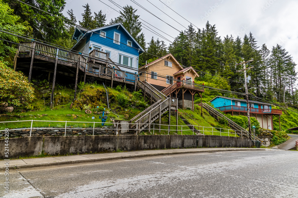 A view down a road with typical stilted houses in Ketchikan, Alaska in summertime