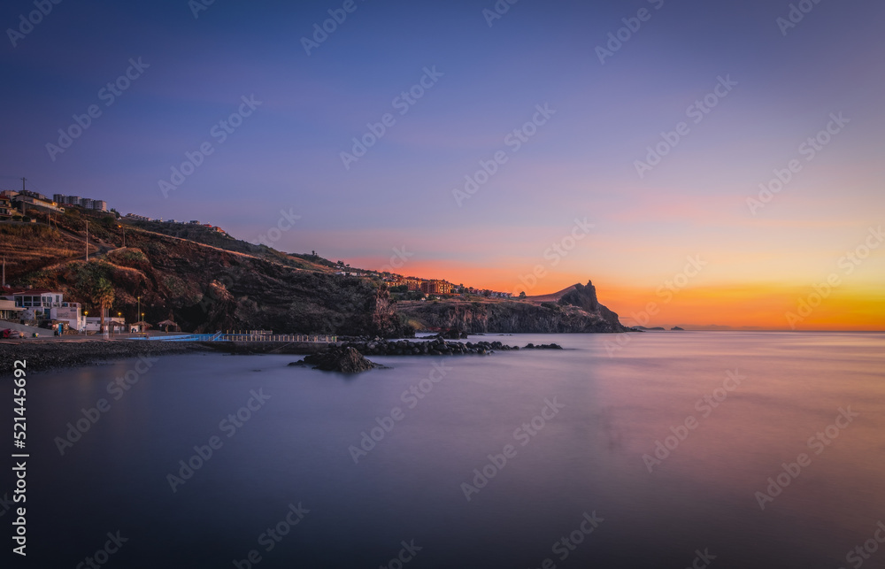 Coastline of Canico de Baixo and Reduto do Portinho rocks at sunrise. Madeira, october 2021. Long exposure picture