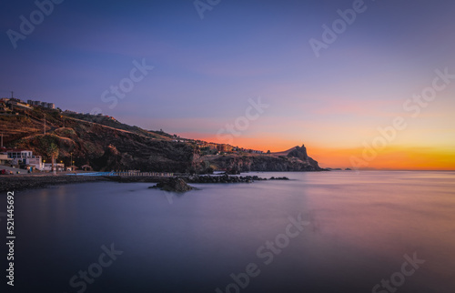 Coastline of Canico de Baixo and Reduto do Portinho rocks at sunrise. Madeira, october 2021. Long exposure picture © Сергій Вовк