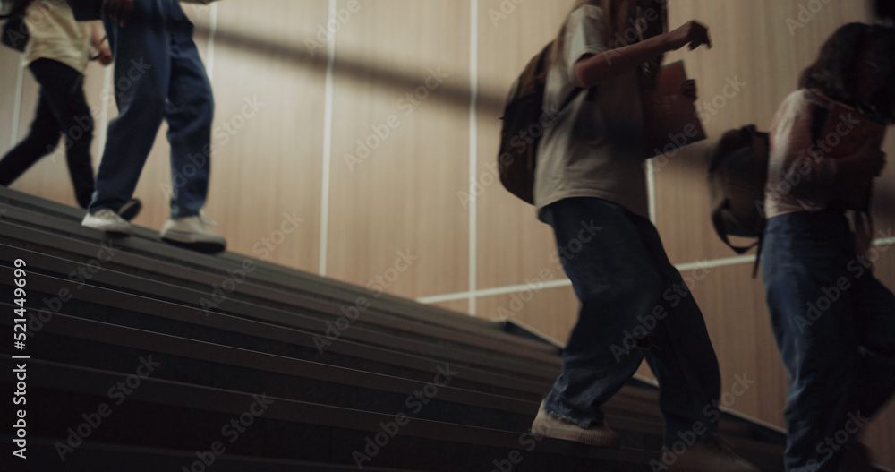 Group teenagers running downstairs school corridor. Children stepping ...