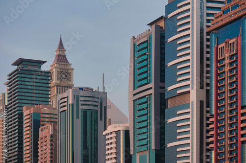 Close-up of tall and modern office and apartment buildings along Sheikh Zayed Road from Al Wasl in the urban city of Dubai, United Arab Emirates. photo