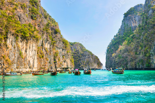 Lagoon of tropical island. Panorama of Phi Phi famous island in Thailand with sea, boats and mountains in lagoon where the Beach movie was filmed