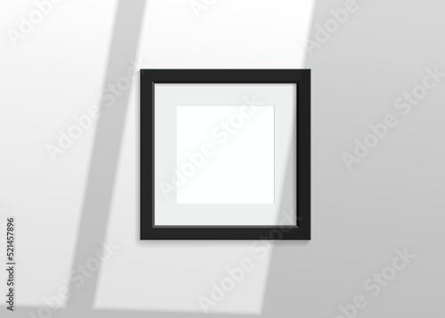Realistic vector mockup with black photo frame. Shadow on the white wall and empty place for your design. 3d soft light and overlay shadow from window. Square poster or painting.