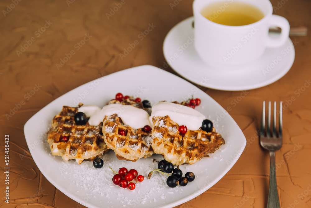 Homemade waffles with berries. Berry Belgian Waffle with raspberries. Culinary, cooking, bakery concept. Homemade waffles with berries. Berry Belgian Waffle with raspberries. Culinary, cooking, bakery concept.