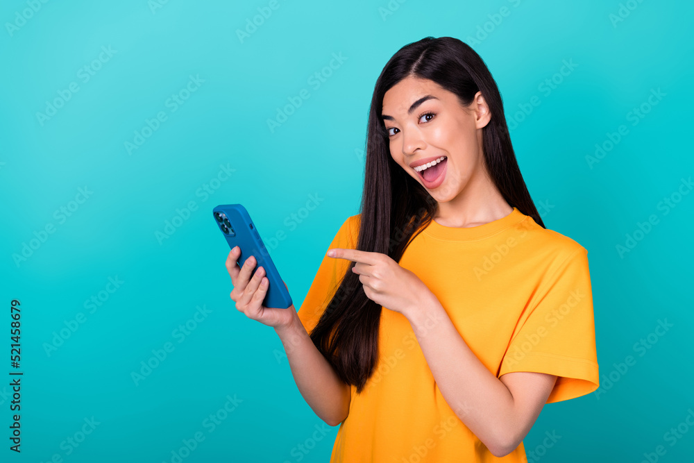 Photo of hooray brunette lady index telephone wear orange t-shirt isolated on turquoise color background Photo of hooray brunette lady index telephone wear orange t-shirt isolated on turquoise color background