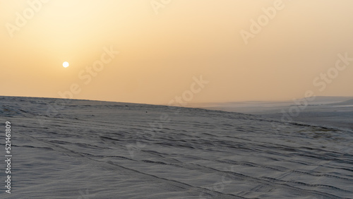 qatar adventurous place khor al udeid  sea line area filled with many dunes.