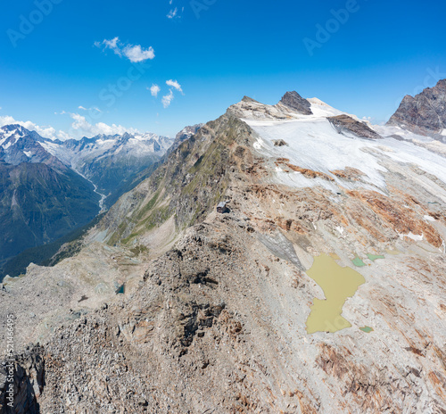 Panoramic aerial view of the Bernina Group and the Scerscen Refuge in Valmalenco, Italy, July 2022	 photo