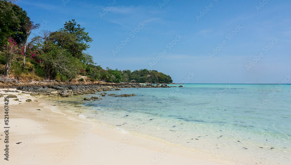 Paradise tropical beach with white sand and turquoise sea. Vacation and travel in Thailand