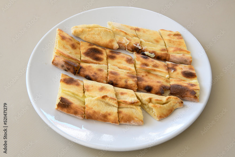 Turkish pita with minced cubed meat and cheese (Turkish name: Kiyma Kusbasi kasarli pide) Turkish pita with minced cubed meat and cheese (Turkish name: Kiyma Kusbasi kasarli pide)