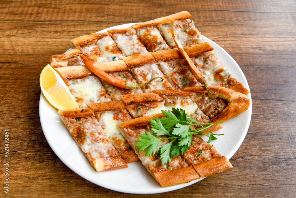 Turkish pita with minced cubed meat and cheese (Turkish name: Kiyma Kusbasi kasarli pide) Turkish pita with minced cubed meat and cheese (Turkish name: Kiyma Kusbasi kasarli pide)