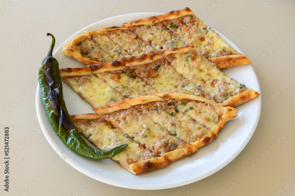 Turkish pita with minced cubed meat and cheese (Turkish name: Kiyma Kusbasi kasarli pide) Turkish pita with minced cubed meat and cheese (Turkish name: Kiyma Kusbasi kasarli pide)