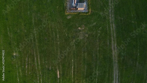 Aerial view of cellular transmitter tower mast during sunset