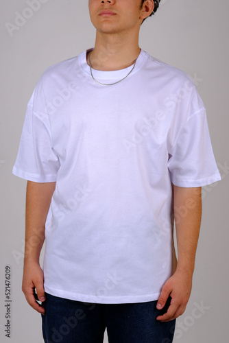 Close up pattern of cotton man in white t-shirt isolated on gray background.