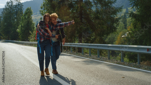 Photography Happy walkers enjoy hitchhike in summer mountains