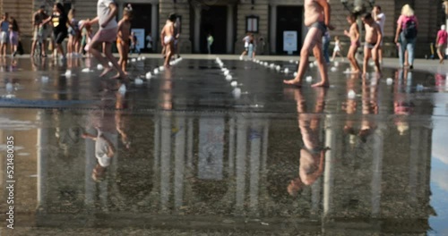 Wallpaper Mural Children cool off in the jets of the fountain in the summer in the city. Slow motion. Out of focus. Torontodigital.ca